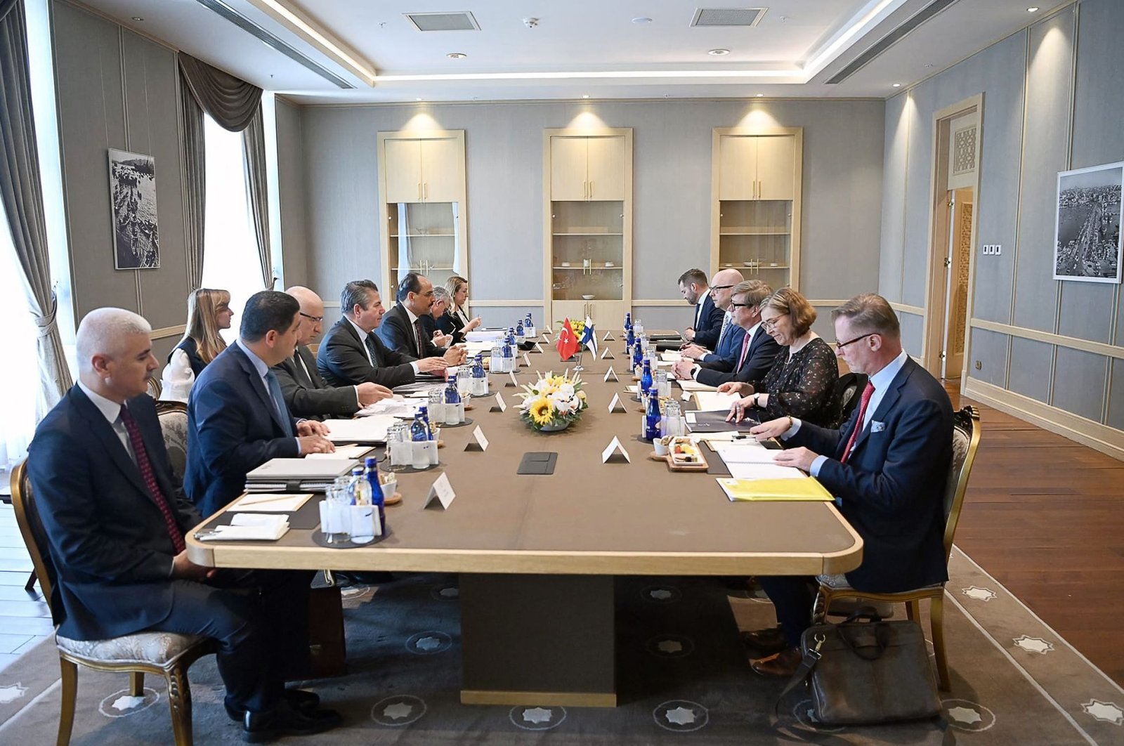 This handout photo taken and released by the Turkish presidential press service on May 25, 2022, shows Turkish Presidential Spokesperson Ibrahim Kalın (6th L) and Jukka Salovaara  (3rd R) attending a meeting over Finland&#039;s bid to join NATO in Ankara. (AFP)