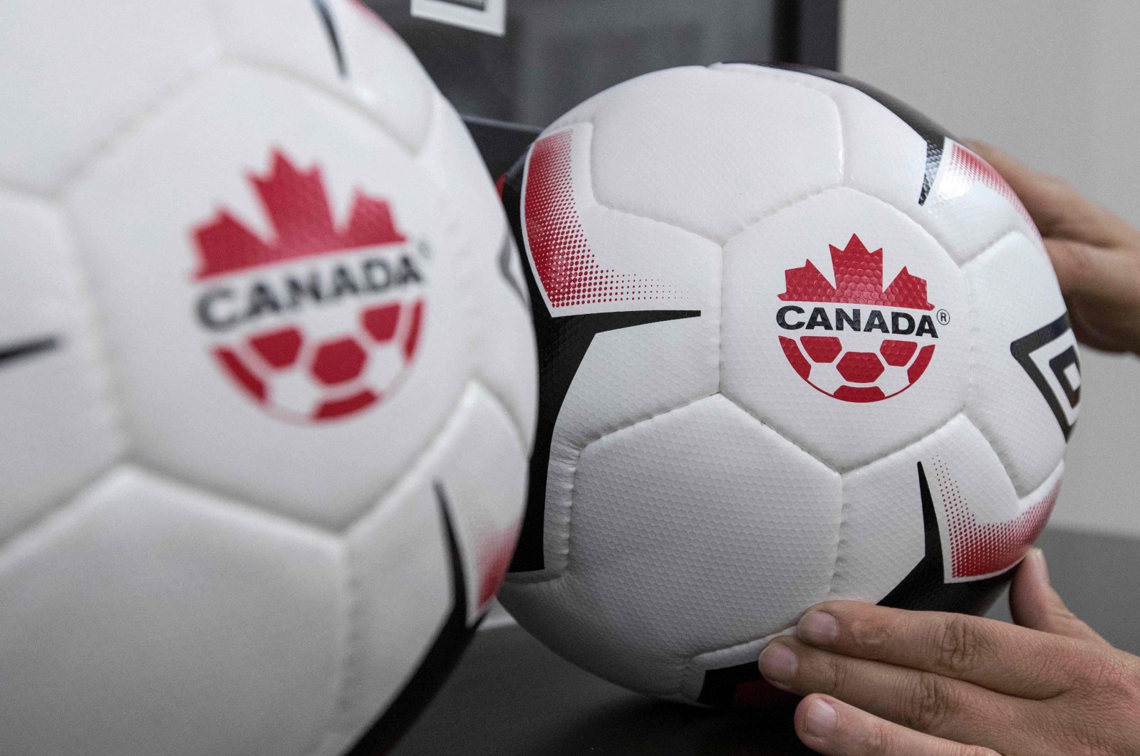 A staff adjusts balls at Soccer Canada Headquarters in Ottawa, Ontario, June 13, 2018. (AFP Photo)