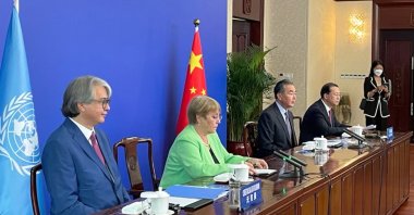 A handout photo made available by the Office of the United Nations High Commissioner for Human Rights (OHCHR) shows Christian Salazar (L), Director of Field Operations and Technical Cooperation Division (OHCHR); UN High Commissioner for Human Rights Michelle Bachelet (2nd L); Wang Yi (3rd L), foreign minister of China, and Vice Foreign Minister of China Mao Zhao Xu (R), attending a virtual meeting with Chinese President Xi Jinping (not pictured), in Guangzhou, China, May 25, 2022. (EPA/OHCHR handout)