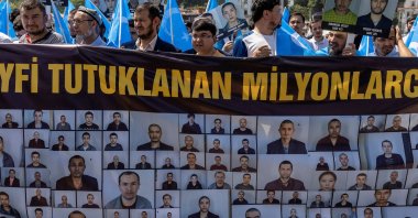 Ethnic Uyghurs display a banner and hold East Turkestan flags during a protest against China near the Chinese Consulate in Istanbul, Turkey, May 26, 2022. (Reuters Photo)