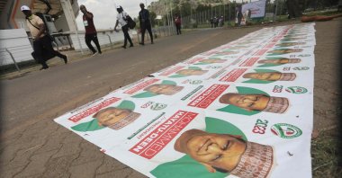 People walk past banners of Nigeria&#039;s opposition party, Peoples Democratic Party, at the Central Area, in Abuja, Nigeria, May 28 2022. (AFP Photo)