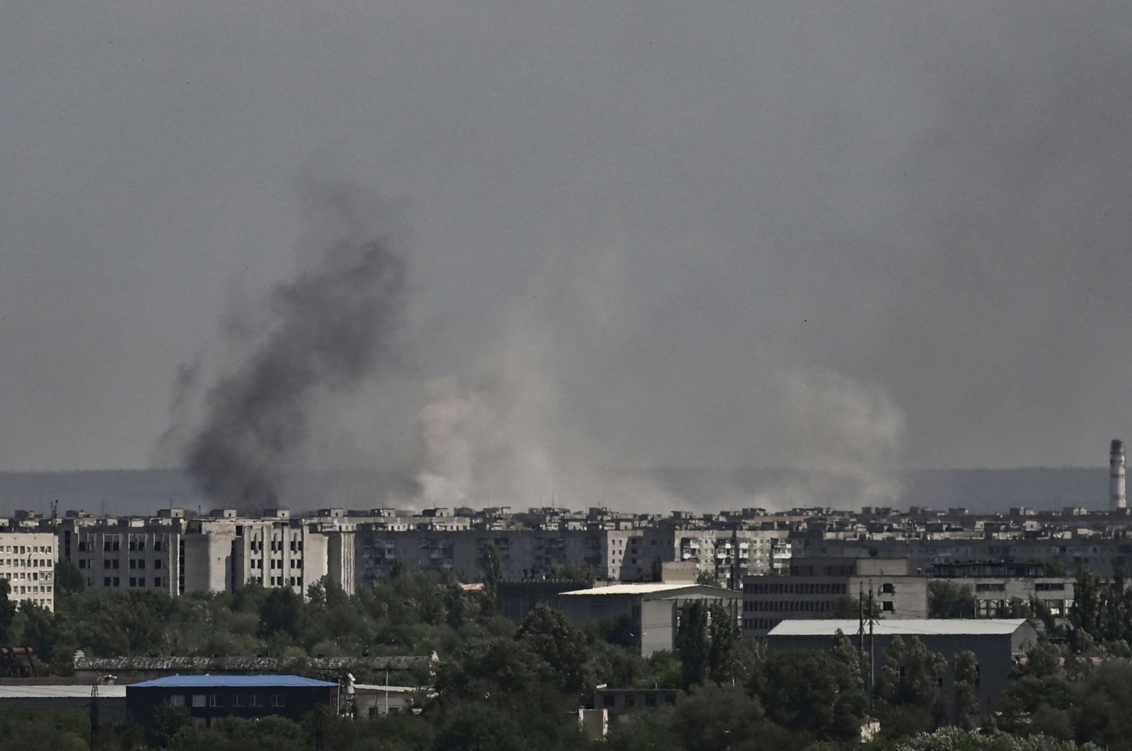 Smoke and dirt rise from the city of Severodonetsk, during shelling in the eastern Ukrainian region of Donbass, on May 26, 2022, amid Russia&#039;s military invasion launched on Ukraine. (AFP Photo)