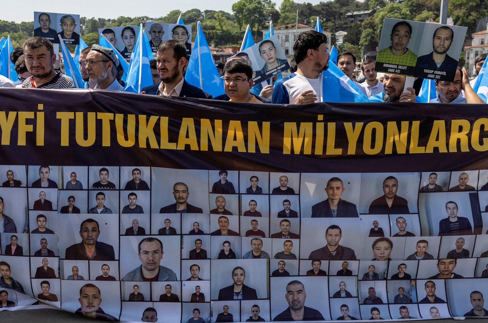 Ethnic Uyghurs display a banner and hold East Turkestan flags during a protest against China near the Chinese Consulate in Istanbul, Turkey, May 26, 2022. (Reuters Photo)