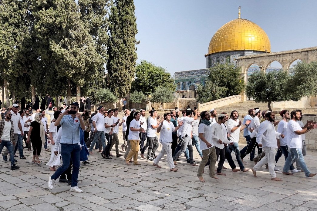 Jewish settlers walk during a visit to the compound known to Muslims as the Noble Sanctuary and to Jews as Temple Mount in East Jerusalem&#039;s Old City, occupied Palestine, May 29, 2022. (Reuters Photo)