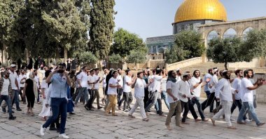 Jewish settlers walk during a visit to the compound known to Muslims as the Noble Sanctuary and to Jews as Temple Mount in East Jerusalem's Old City, occupied Palestine, May 29, 2022. (Reuters Photo)