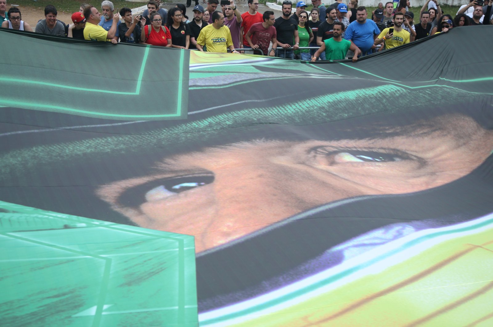 Fans of Ayrton Senna with a flag of the three times F1 World Champion, Sao Paulo, Brazil, Nov. 9, 2019.