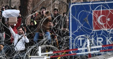 Migrants wait on the Turkish side of the Turkey-Greece border in this photograph taken from Kastanies, Greece, March 2, 2020. (AFP File Photo)