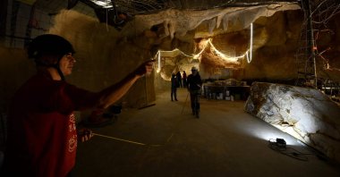 The workers are seen on the site of the Cosquer cave replica at the Villa Mediterranee in Marseille, southern France, Nov. 23, 2021. (AFP Photo)