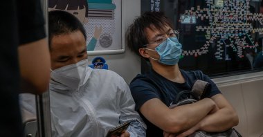 People ride a train in Beijing, China, May 30, 2022. (EPA Photo)