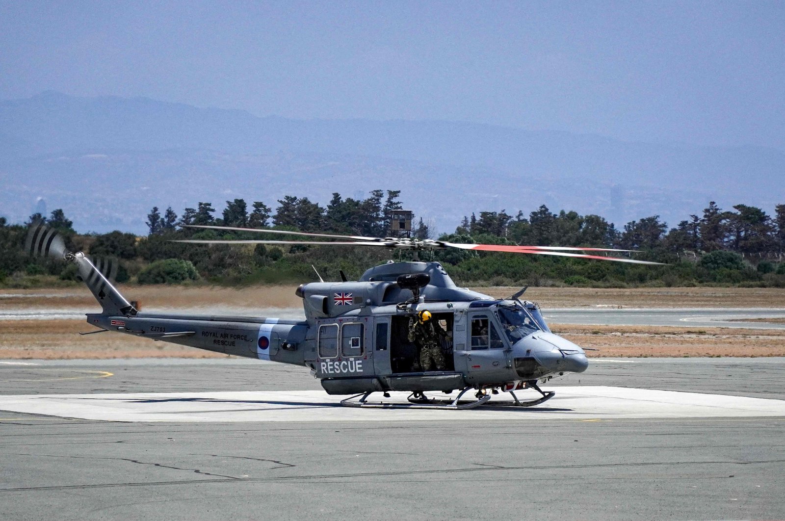 A Royal Air Force Bell Griffin HAR2 utility helicopter prepares for takeoff at the RAF Akrotiri British military sovereign base area (SBA), southwest of the coastal Greek Cypriot city of Limassol, May 25, 2022. (AFP Photo)