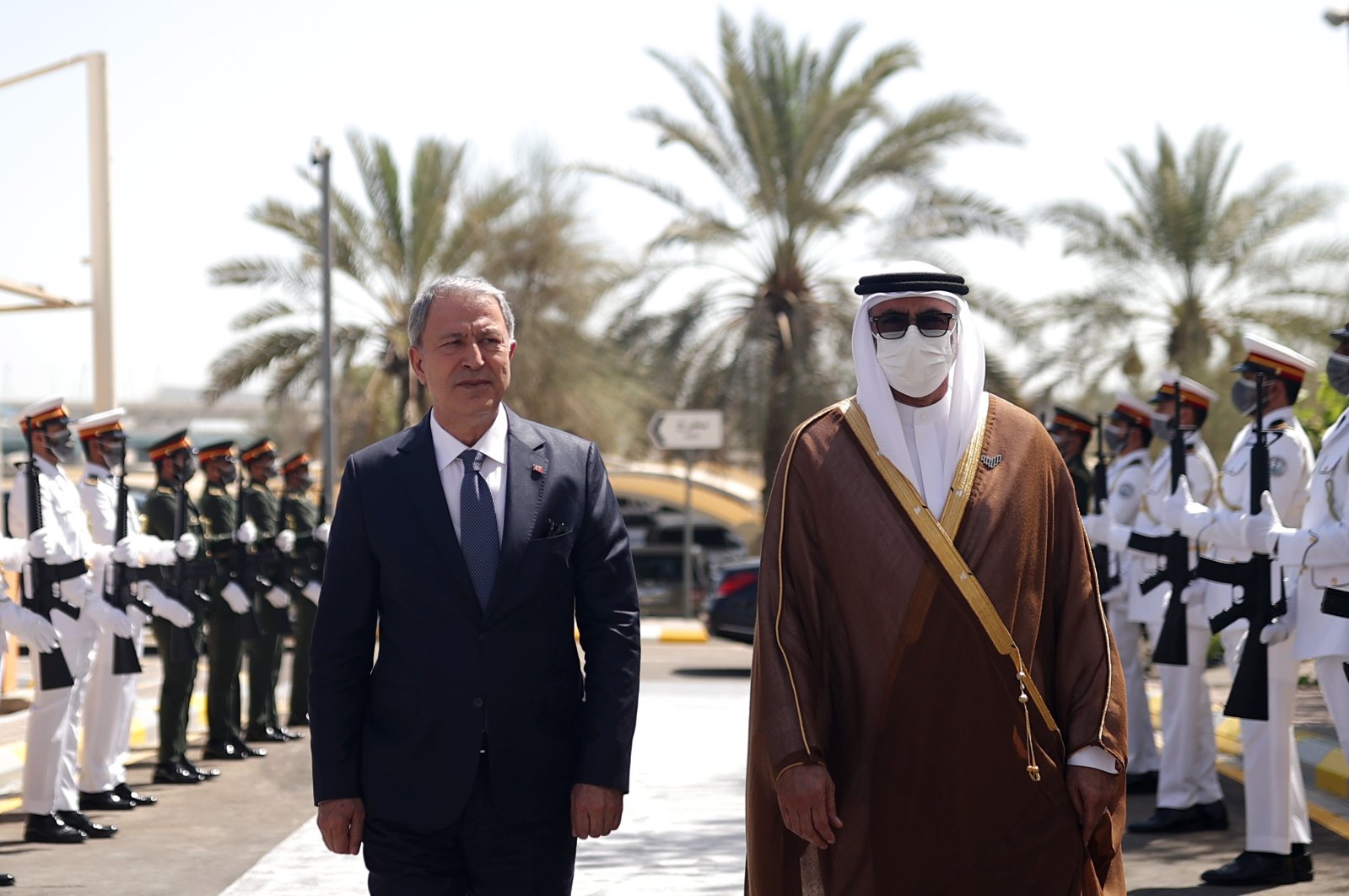 Defense Minister Hulusi Akar (L) is received by his Emirati counterpart Mohammed Ahmed Al Bowardi with an official ceremony in Abu Dhabi, UAE, May 30, 2022. (AA Photo)
