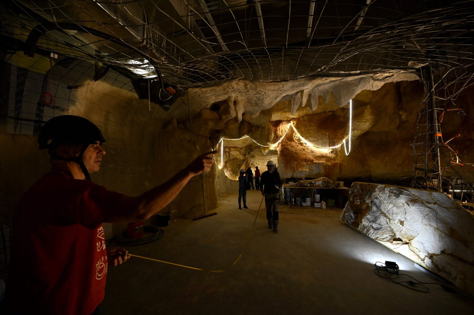The workers are seen on the site of the Cosquer cave replica at the Villa Mediterranee in Marseille, southern France, Nov. 23, 2021. (AFP Photo)