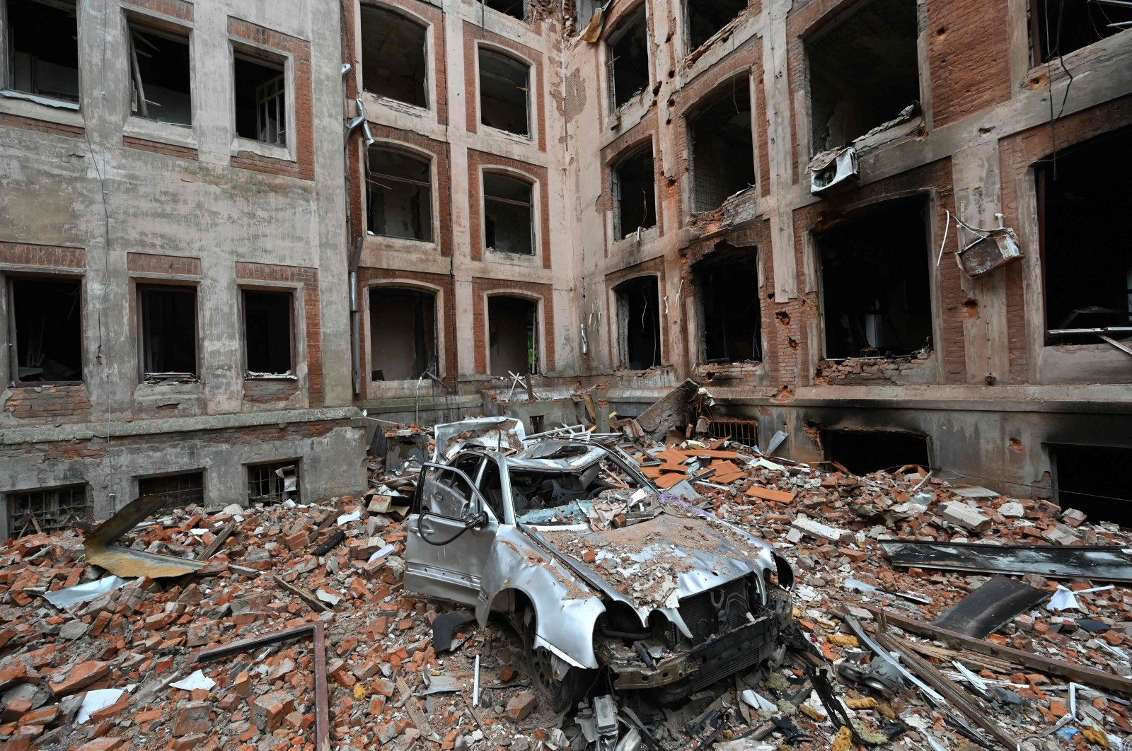 This photograph shows the damaged building of the Faculty of Economics of Karazin National University in Kharkiv, amid Russian invasion of Ukraine, May 28, 2022. (AFP Photo)