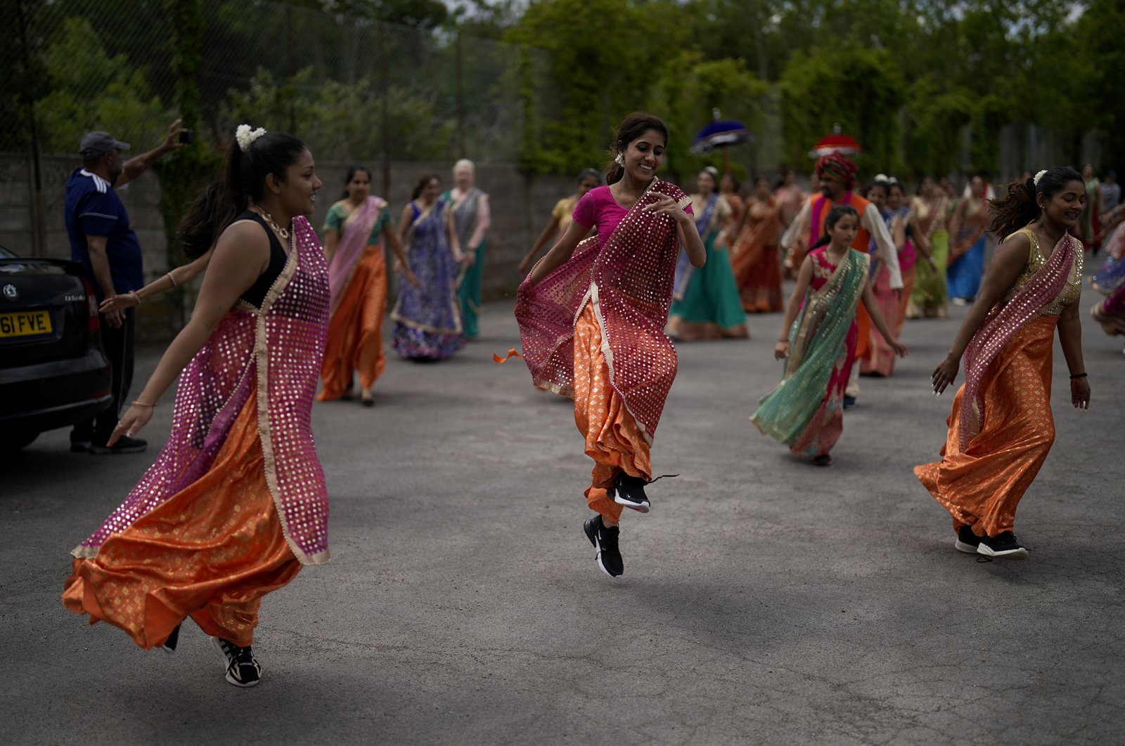 Performers take part in a rehearsal for their upcoming Bollywood-style performance entitled "The Wedding Party," at Northolt High School, in north west London, U.K., May 29, 2022. (AP Photo)