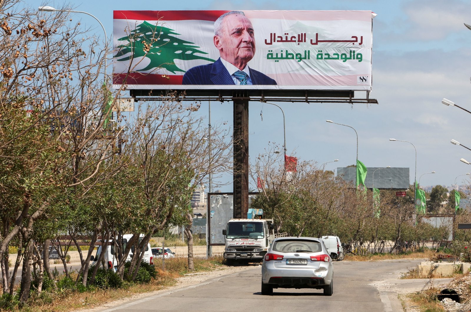 A view shows a billboard depicting Lebanese parliament speaker Nabih Berri and reading &quot;A man of moderation and national unity&quot; in Ghazieh, southern Lebanon, April 21, 2022.  (REUTERS Photo)