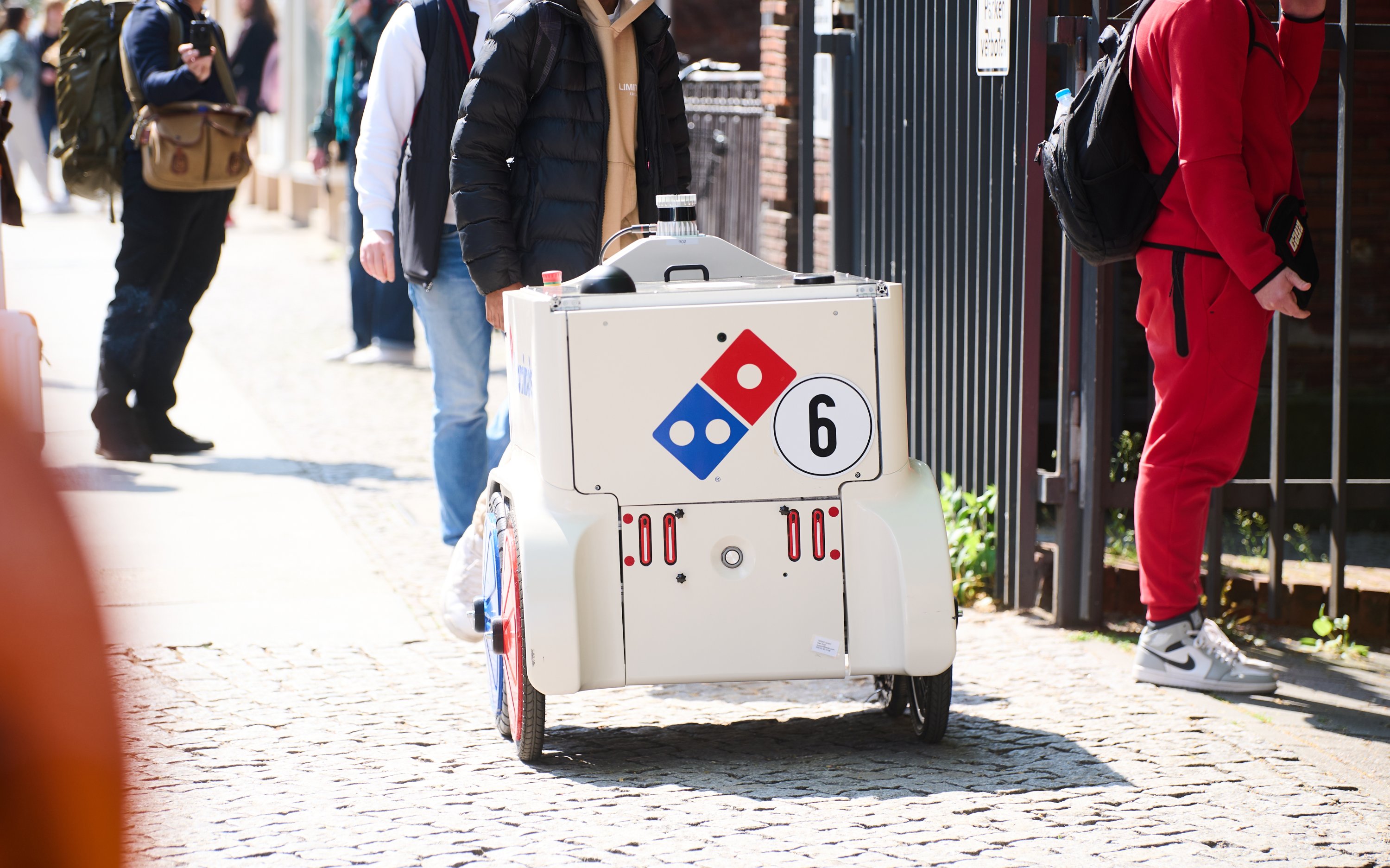 Domino's waist-high pizza delivery droid has four sensors and several cameras which allow it to detect when people or other obstacles block its path, Berlin, Germany, May 2, 2022. (DPA Photo)