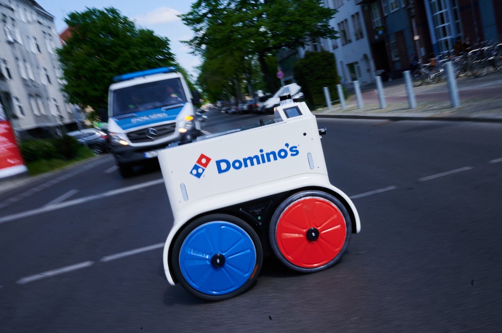 The Domino&#039;s pizza delivery robot crossing a street in Berlin, Germany, May 2, 2022. (DPA Photo)