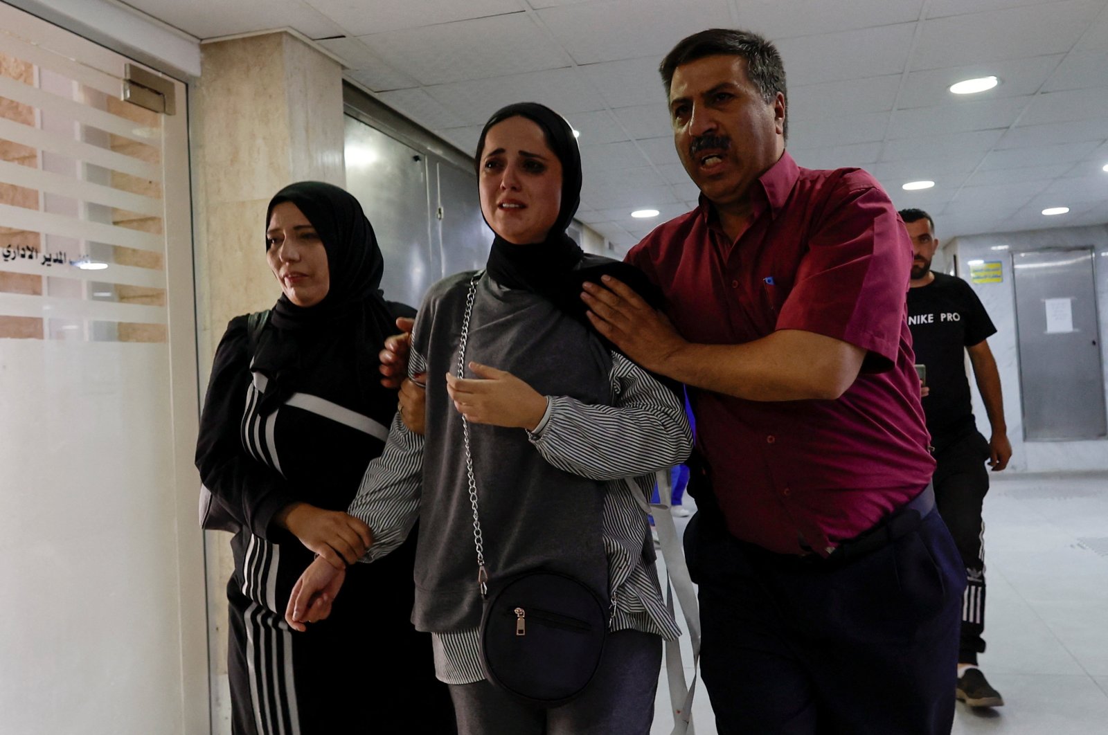 People react at a hospital after a Palestinian woman was killed in an incident at an Israeli checkpoint in Hebron, occupied West Bank, Palestine, June 1, 2022. (Reuters Photo)