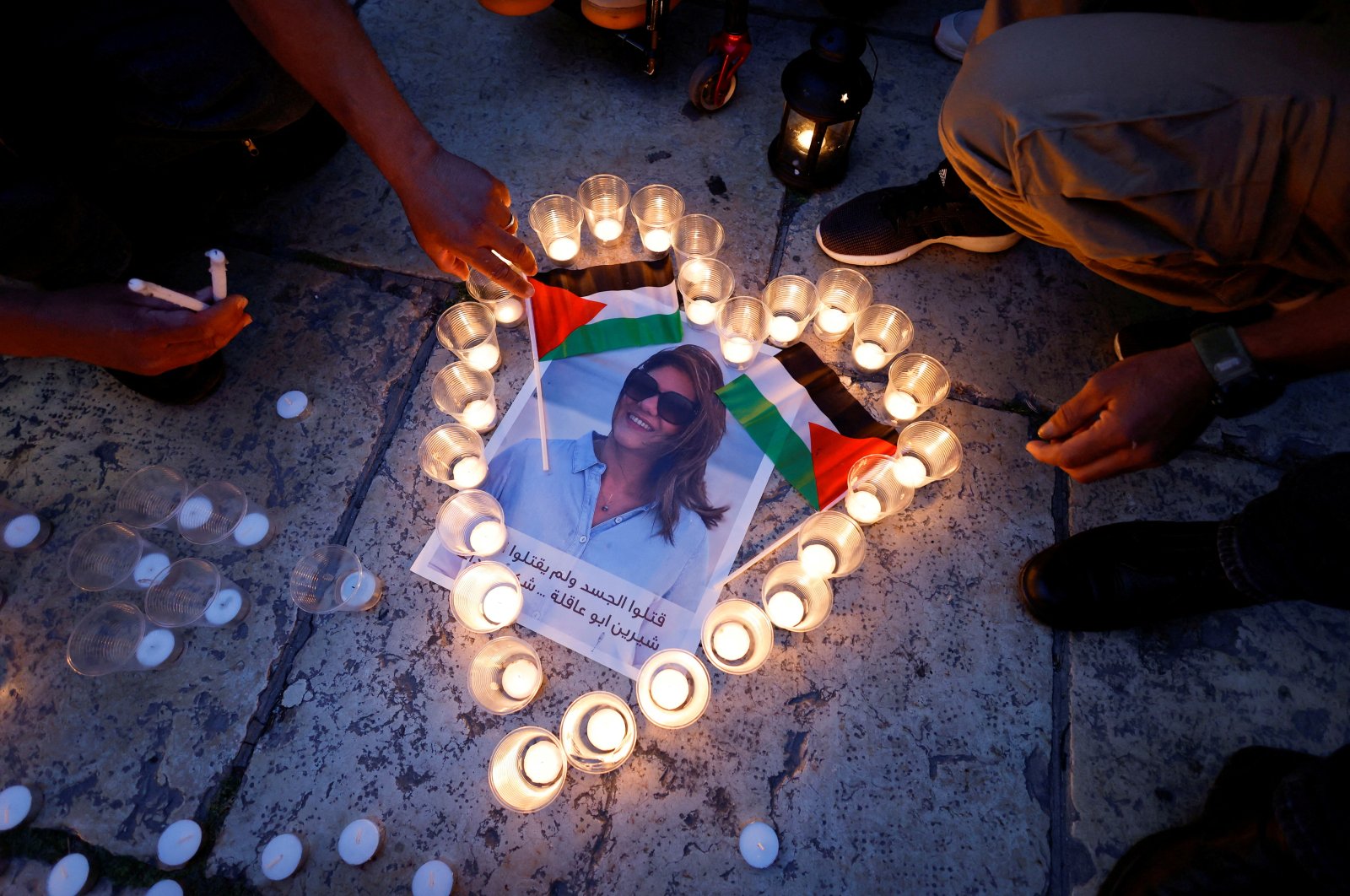 People light candles during a vigil in memory of Al Jazeera journalist Shireen Abu Akleh, Bethlehem, occupied West Bank, Palestine, May 16, 2022. (Reuters Photo)