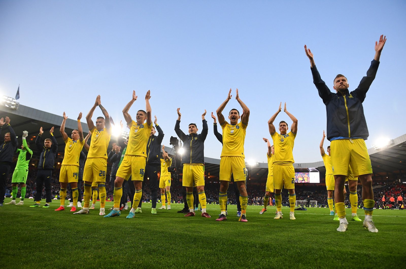Ukraine&#039;s players applaud their fans after winning the FIFA World Cup 2022 playoff semifinal qualifier football match between Scotland and Ukraine at Hampden Park in Glasgow, Scotland on June 1, 2022. (AFP Photo)