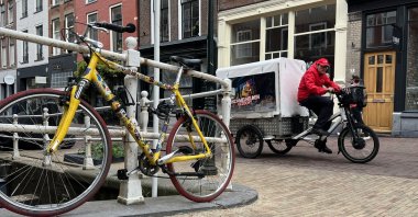 A man rides a three-wheel bicycle on a street in Utrecht, the Netherlands, June 2, 2022. (AA Photo)