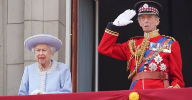 Queen Elizabeth II (L) stands with Britain's Prince Edward, Duke of Kent, on the Balcony of Buckingham Palace as the troops march past during the Queen's Birthday Parade, the Trooping the Colour, in London, U.K., June 2, 2022. (AFP Photo)