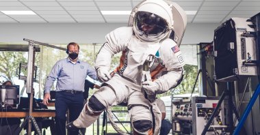 A person wears the new Collins Aerospace astronaut suit during a demonstration, North Carolina, U.S., Sept. 24, 2021. (Collins Aerospace via AFP)