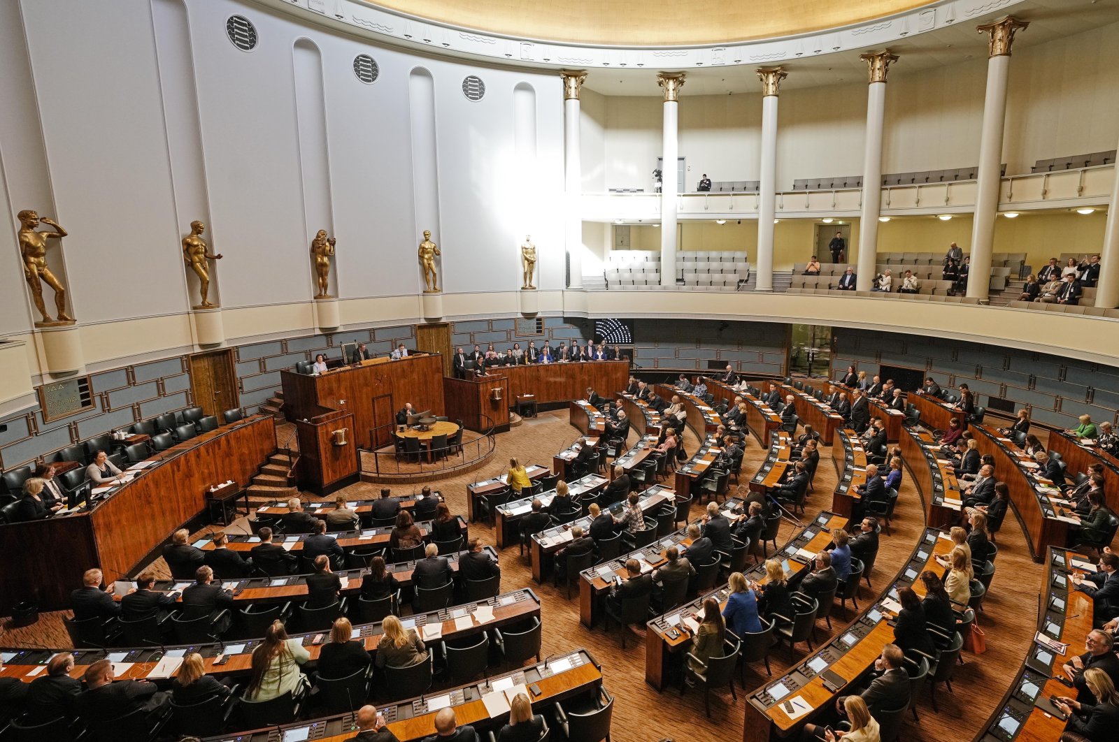 Members of parliament listen to Prime Minister of Finland Sanna Marin at the Finnish Parliament in Helsinki, Finland, Monday, May 16, 2022. (AP File Photo)