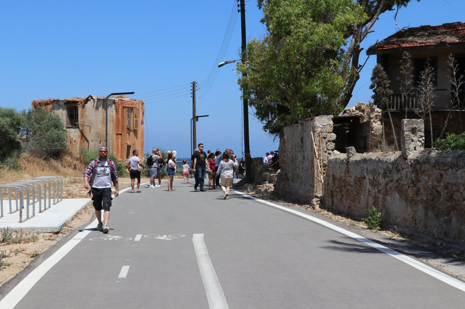 Tourists stroll around the streets of Varosha, Turkish Republic of Northern Cyprus, June 1, 2022. (AA Photo)