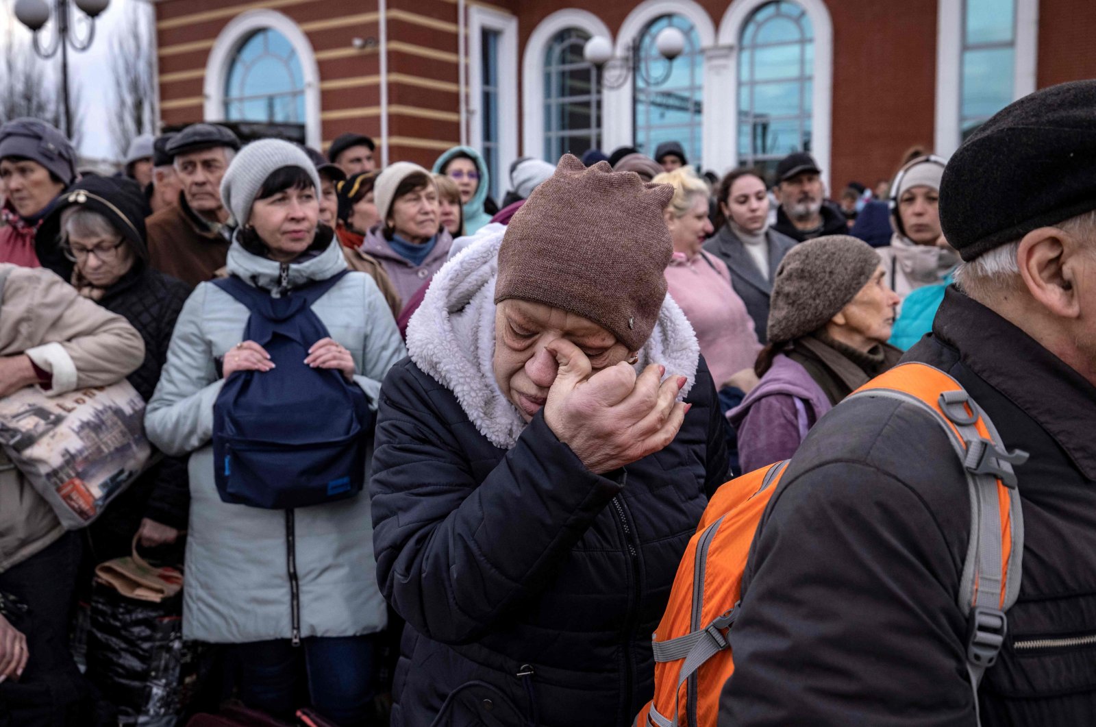 A woman gestures as families wait to board a train at Kramatorsk central station as they flee the eastern city of Kramatorsk, Donbass, Ukraine, April 5, 2022. (AFP Photo)