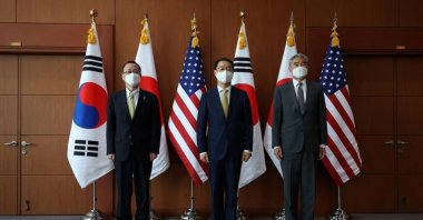 Kim Gunn, South Korea's new special representative for Korean Peninsula peace and security affairs, his U.S. counterpart Sung Kim and Japanese counterpart Takehiro Funakoshi pose for photographs before their meeting at the Foreign Ministry, Seoul, South Korea, June 3, 2022. (Reuters Photo)