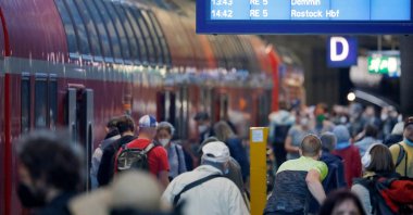 Passengers queue to enter a regional train directed to Rostock at the Berlin central station, Berlin, Germany, June 3, 2022. (Reuters Photo)