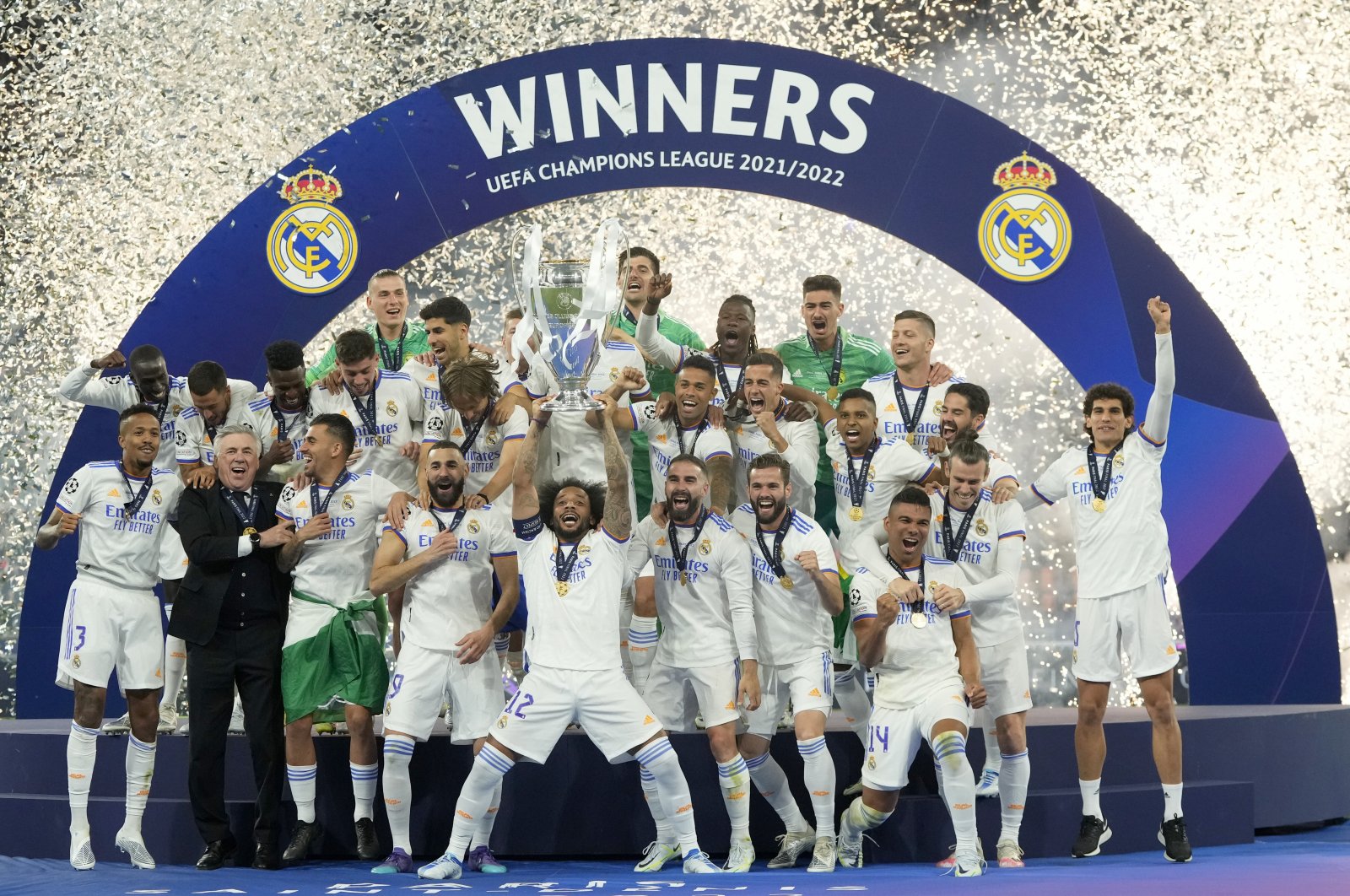Real Madrid&#039;s Marcelo lifts the trophy after winning the Champions League final soccer match against Liverpool, in Paris, France, May 28, 2022. (AP PHOTO) 