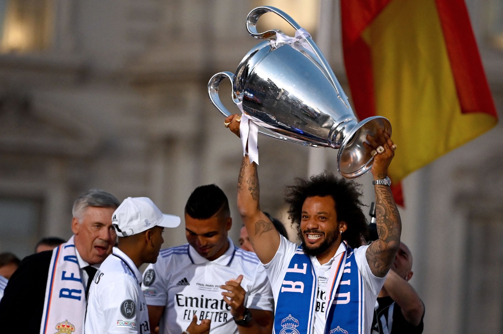 Real Madrid&#039;s Brazilian defender Marcelo lifts their trophy at the Cibeles square in Madrid, a day after beating Liverpool in the UEFA Champions League final, Madrid, Spain, May 29, 2022. (AFP Photo)