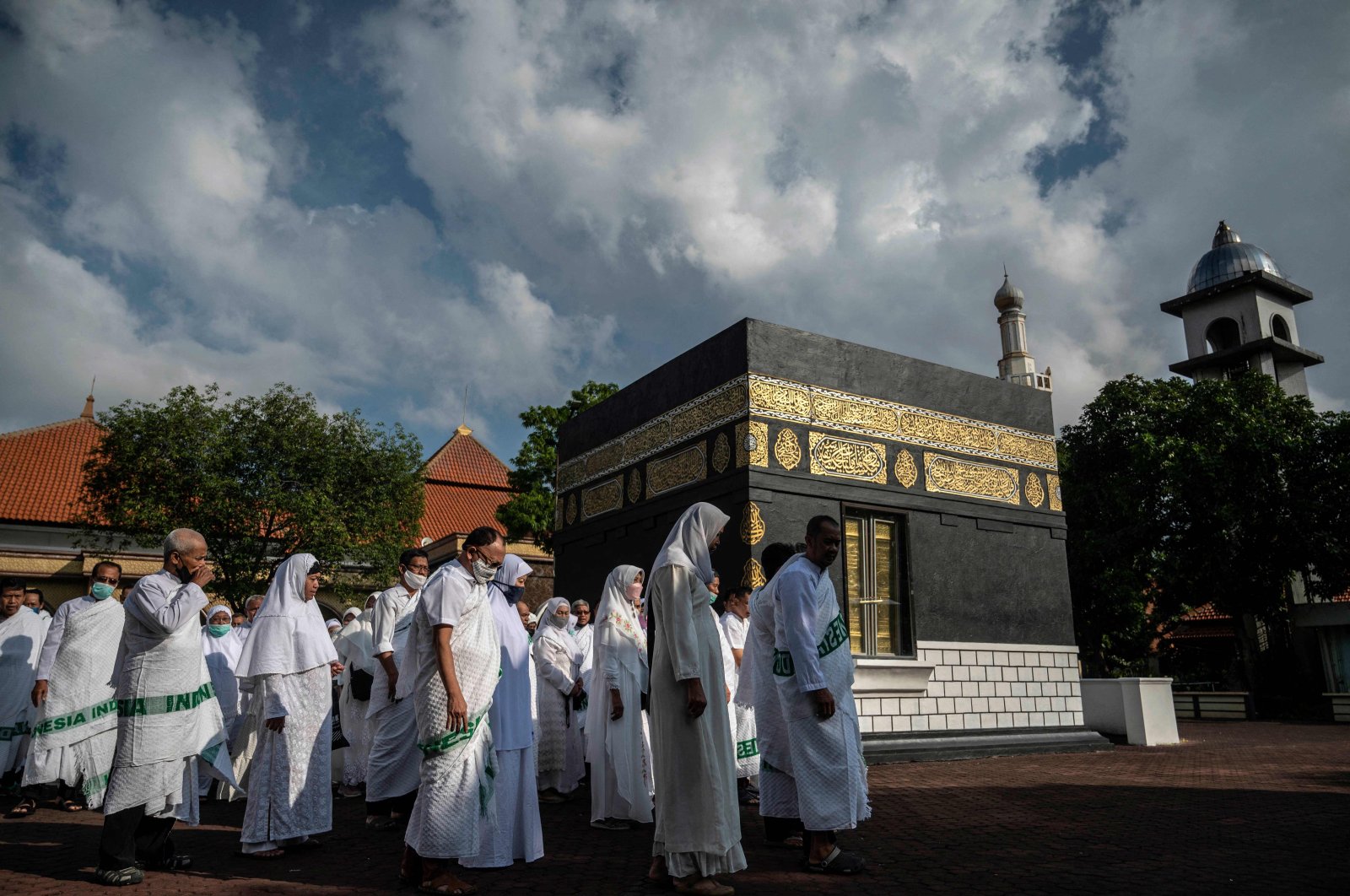 Indonesian Muslims simulate the circumambulation of a mock Kaaba as part of preparations ahead of their Hajj pilgrimage, one of the five pillars of Islam and undertaken by all Muslims who have the means at least once in their lives, Surabaya, Indonesia, May 22, 2022. (AFP Photo)