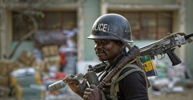 A Nigerian policeman provides security at the offices of the Independent National Electoral Commission in Kano, northern Nigeria, Feb. 14, 2019. (AP File Photo)