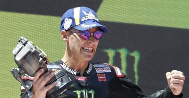 French MotoGP rider Fabio Quartararo of Monster Energy Yamaha MotoGP team celebrates on the podium after winning the Grand Prix of Catalonia race at Circuit de Barcelona-Catalunya track, in Montmelo, Barcelona, northeastern Spain, June 5, 2022.  (EPA Photo)