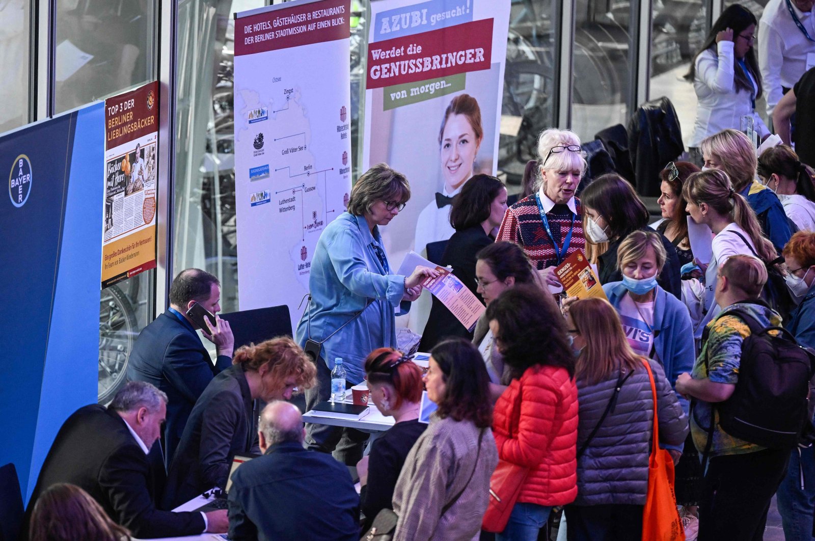 Refugees from Ukraine line up for information at a booth at a job fair in Berlin, Germany, June 2, 2022. (AFP Photo)