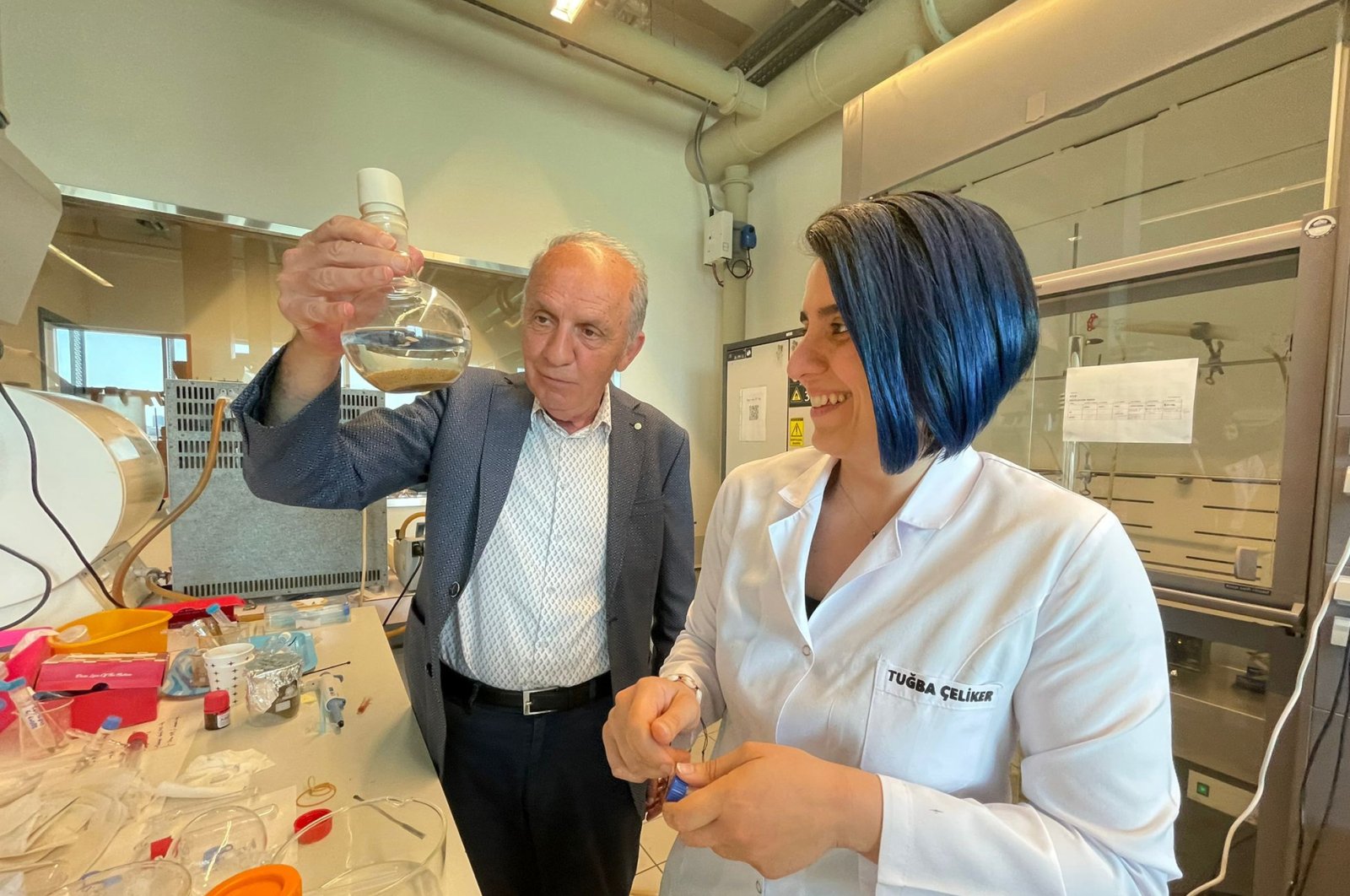 Professor Yusuf Yağcı and researcher Tuğba Çeliker (R) in their lab, Istanbul, Turkey, Jun. 5, 2022. (AA Photo)