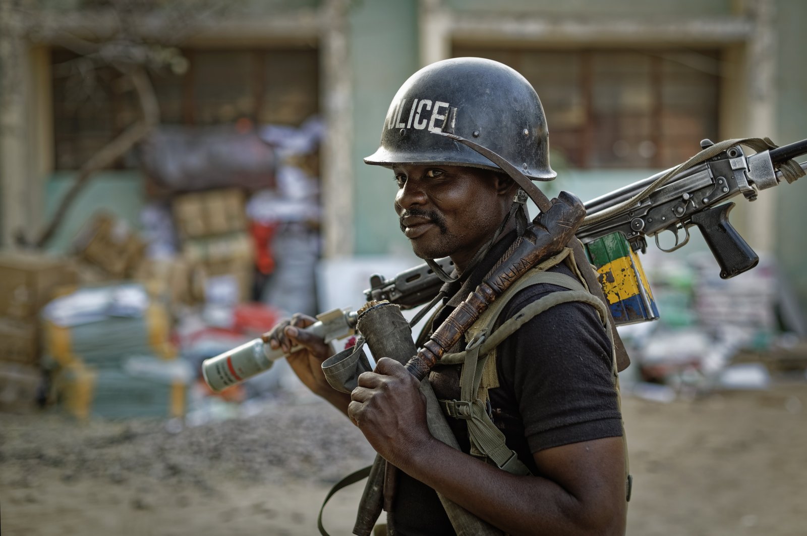 A Nigerian policeman provides security at the offices of the Independent National Electoral Commission in Kano, northern Nigeria, Feb. 14, 2019. (AP File Photo)