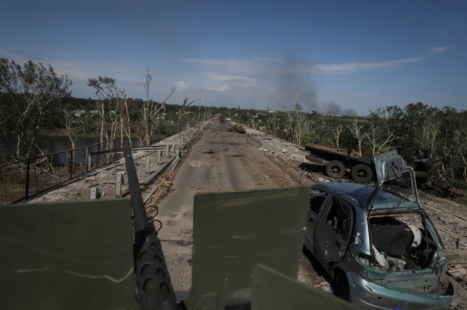 Members of a foreign volunteers unit that fights in the Ukrainian army drive on a military vehicle, as Russia&#039;s attack on Ukraine continues, in Sievierodonetsk, Luhansk region Ukraine, June 2, 2022. (Reuters File Photo)