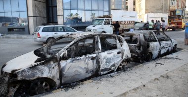 Vehicles damaged after overnight clashes between fighters loyal the Tripoli-based government and the Tobruk-based one in Tripoli, Libya, 17 May 2022. (EPA)
