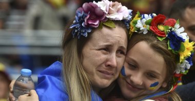 Ukraine fans react before the World Cup 2022 qualifying playoff against Wales, Cardiff, Wales, June 5, 2022. (AP Photo)