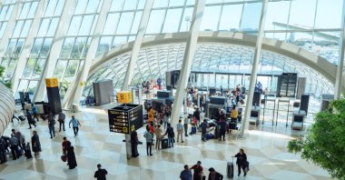 Passengers standing in line for an x-ray at the checkpoint at the entrance of the airport terminal, in Baku, Azerbaijan, May 20, 2019. (Shutterstock Photo)