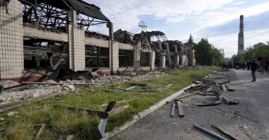 Wreckage lies along a street at a railway service facility hit by a Russian missile strike in Kyiv, Ukraine, June 5, 2022. (AP Photo)