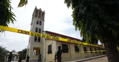 Nigerian police stand guard outside of the St. Francis Catholic church in Owo, Nigeria on June 6, 2022, a day after an attack that targeted worshippers. (AP Photo)