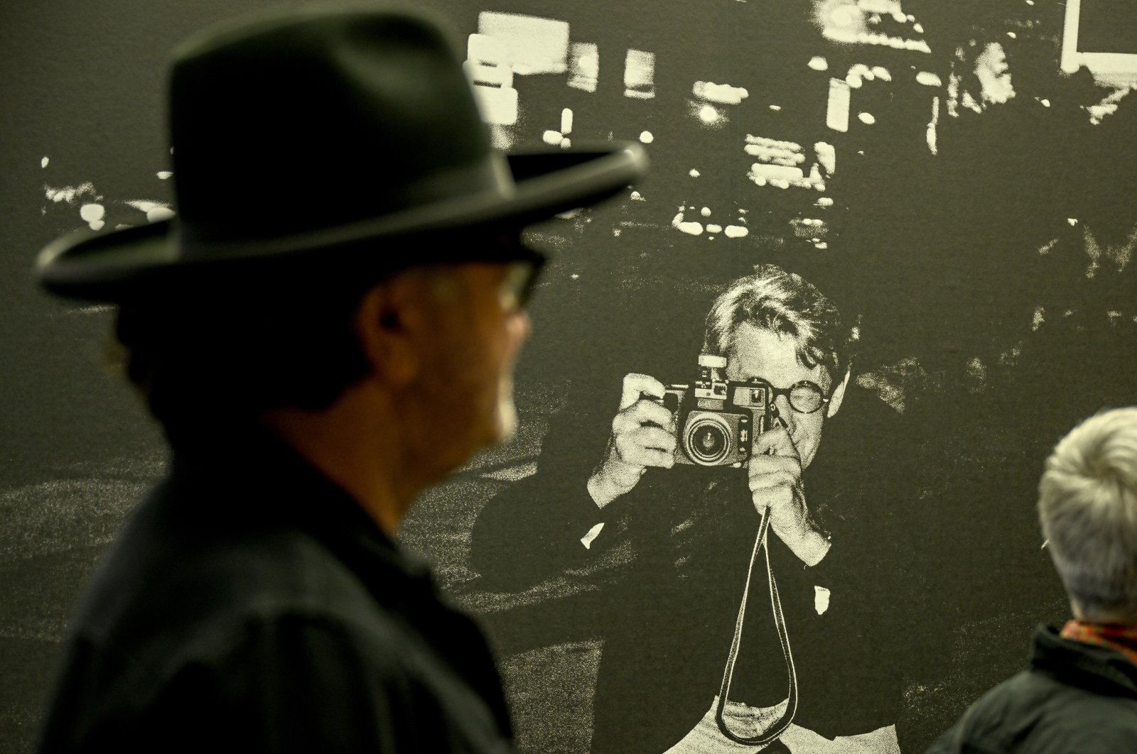 A visitor walks past a picture by photographer Helmut Newton in the Helmut Newton Foundation&#039;s &quot;Hollywood&quot; exhibition. (DPA)