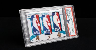 The "Triple Logoman" card, a single-issue card featuring the 18-time NBA All-Star LeBron James, including patches taken from jerseys he wore while with the Cleveland Cavaliers, Miami Heat and Los Angeles Lakers, is seen in this undated handout photo. (Reuters Photo)