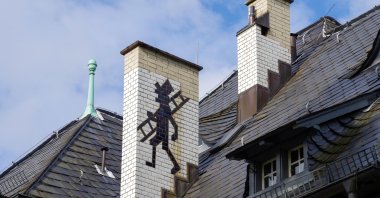 A drawing of a chimney sweep on a rooftop in Baden-Baden, Germany. (Alamy via Reuters)