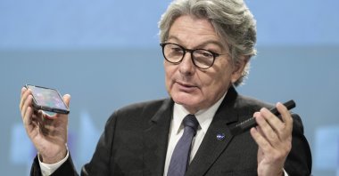 European Internal Market Commissioner Thierry Breton speaks during a media conference on a common charging solution for mobile phones at the EU headquarters in Brussels, Belgium, Sept. 23, 2021. (AP Photo)